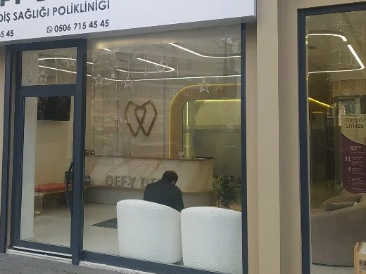 Reception and waiting area visible through DEFY DENT's façade