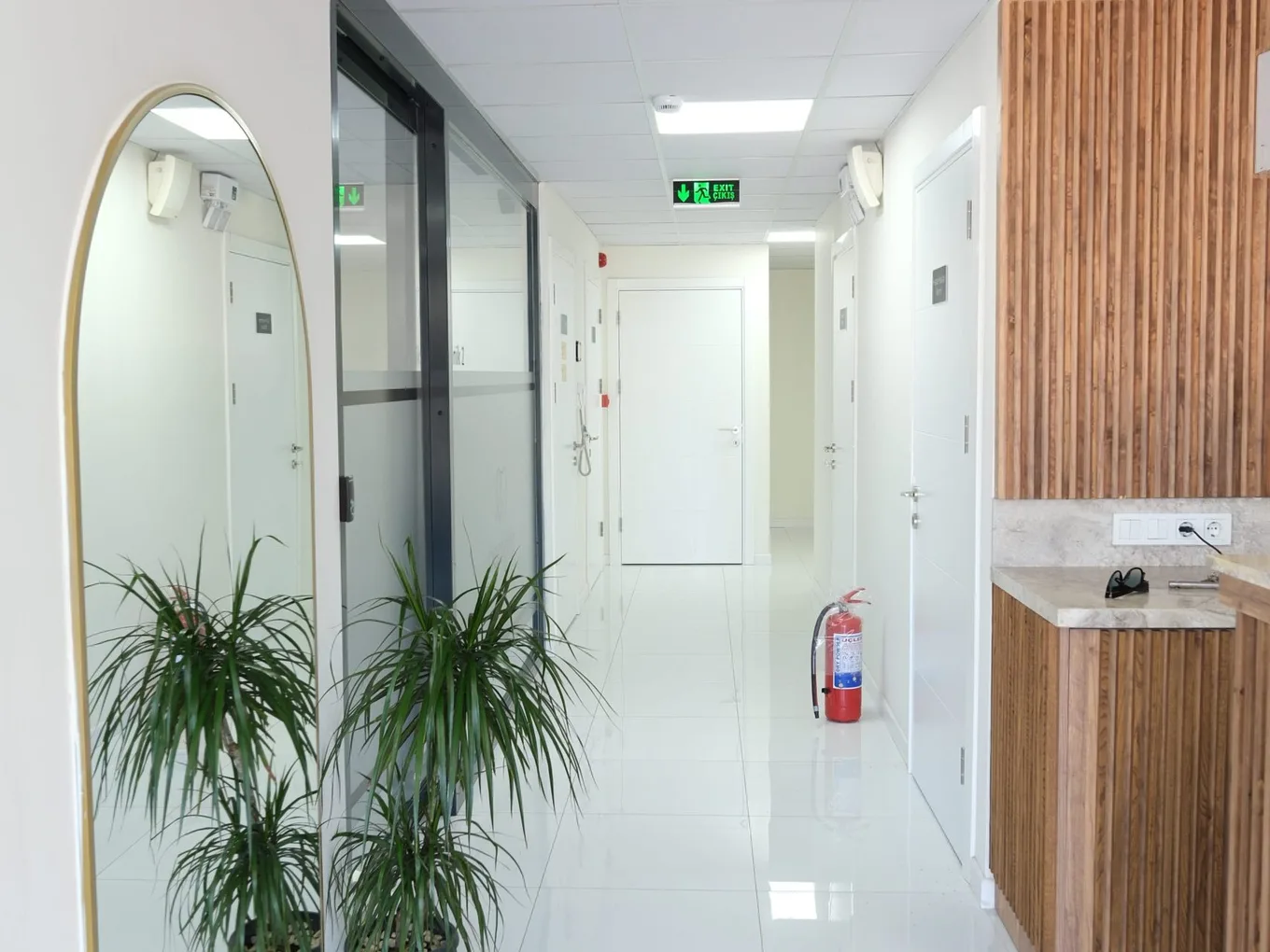 Denteda's bright clinic corridor and treatment rooms