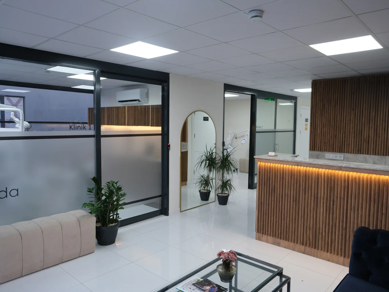Denteda-branded reception desk and waiting area