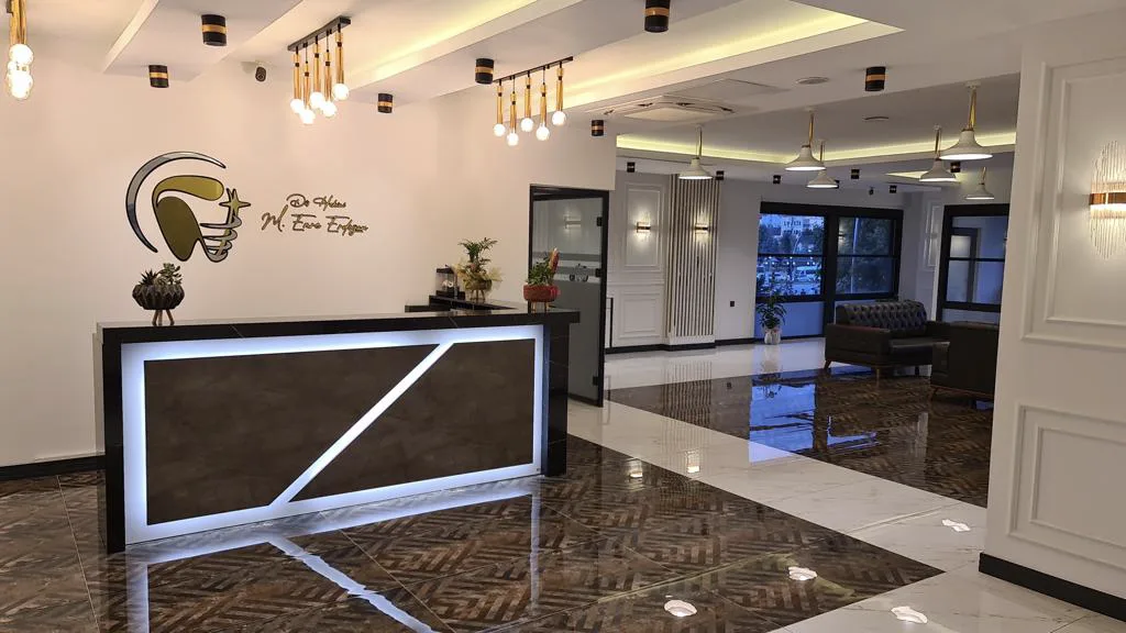 Welcome desk and clinic emblem at Dt. Kadir Şahin Dental Practice