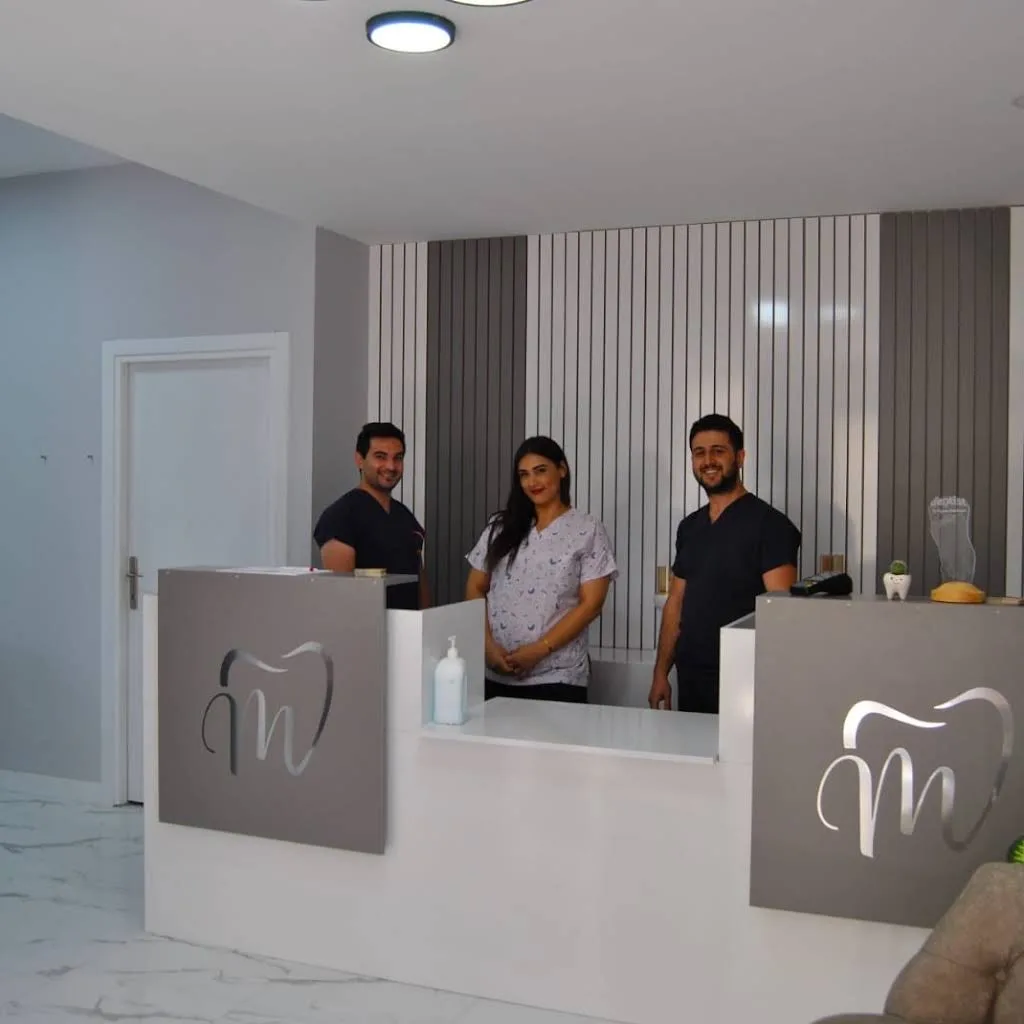 Dt. Nizam Abdullayev and the clinic team at reception