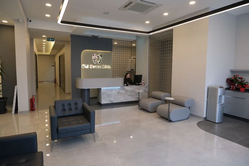 CM Dental Clinic branded reception desk and clinic team