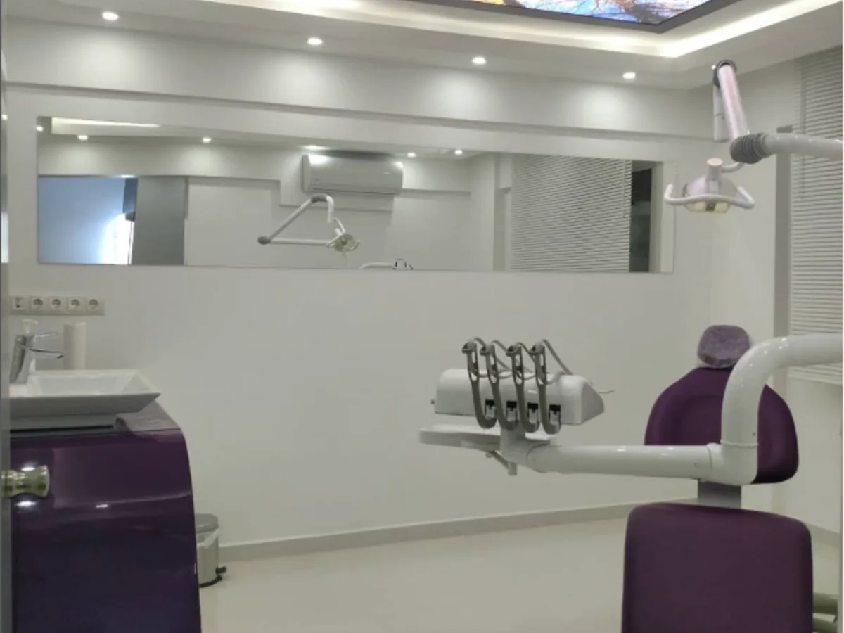 Dent 232 treatment room with a purple dental unit