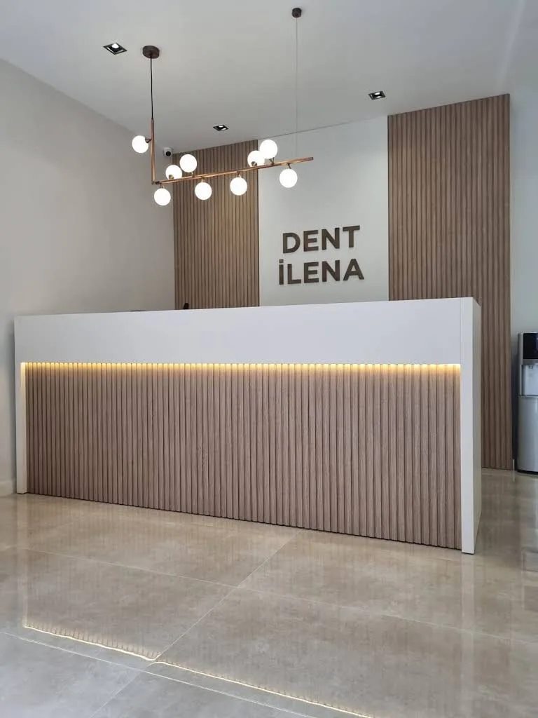 Reception desk with the Özel Dent İlena sign visible