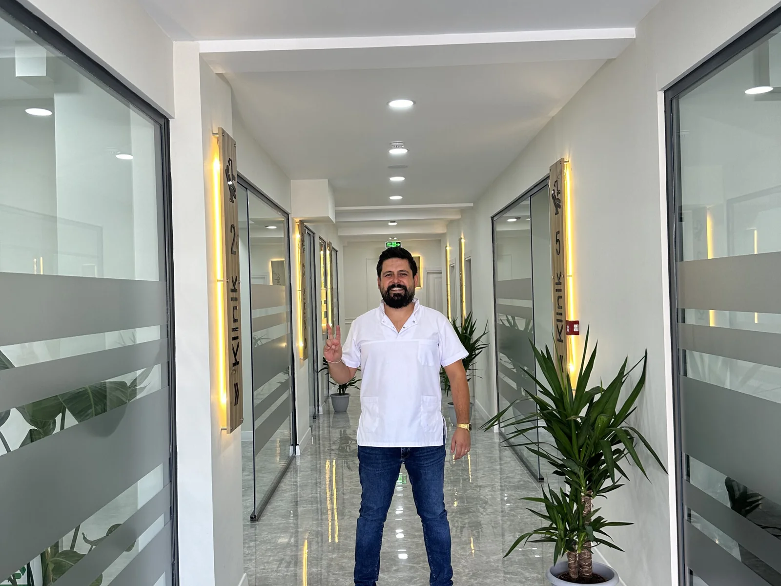 Orthodontist Emre Köse in the Motto Dental clinic corridor