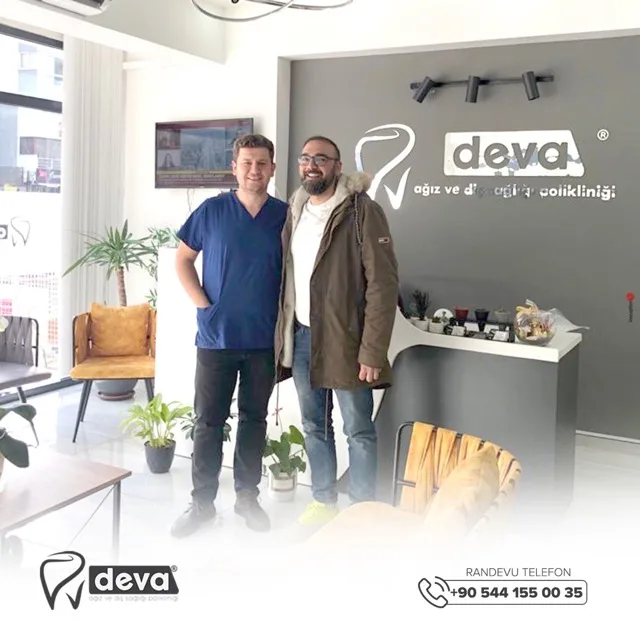 Dentist and visitor in Deva's branded reception area