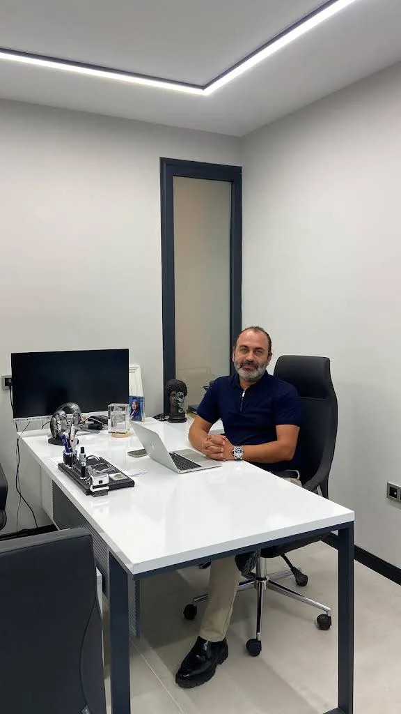 Assoc. Prof. Dr. Ender Şahin at the consultation desk in his practice