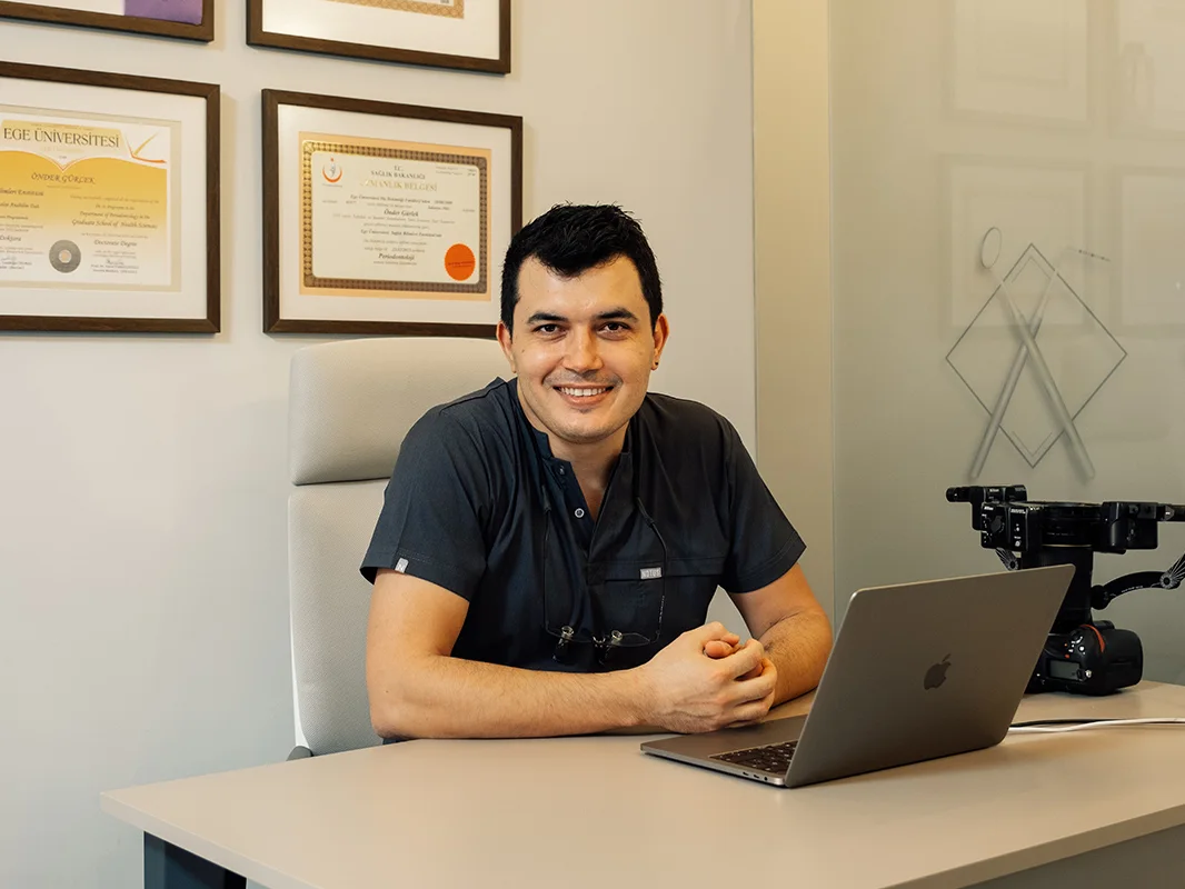 Assoc. Prof. Dr. Önder Gürlek at his desk in the practice